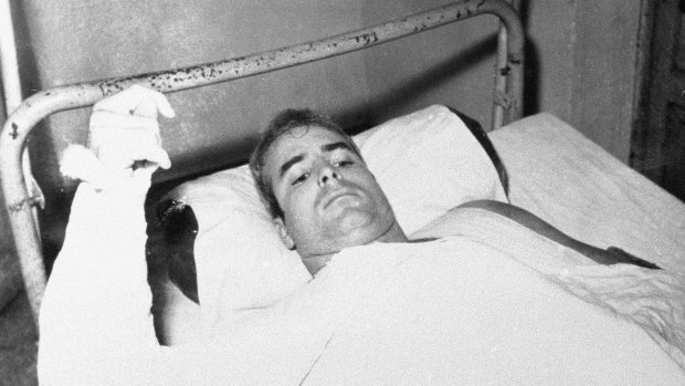 John McCain lies injured in North Vietnam.