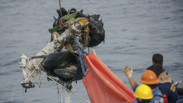 Rescuers use crane to retrieve part of the landing gears of the crashed Lion Air jet from the sea floor in the waters of Tanjung Karawang, Indonesia.