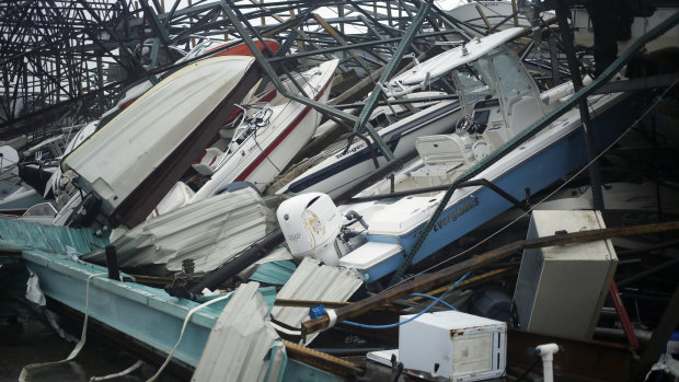Boats sit in a storage warehouse damaged by Hurricane Michael in Panama City Beach, Florida.