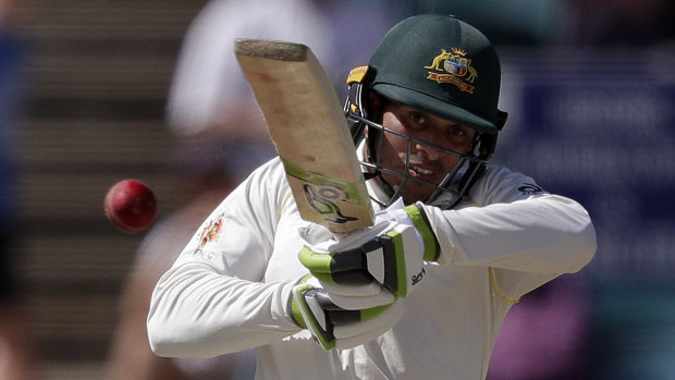 Aggressive: Khawaja takes toll of a shorter delivery.