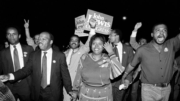 John Lewis, front left, and his wife, Lillian, holding hands, lead a march of supporters in 1986.