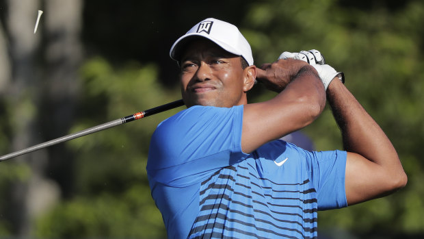 Back against expectations: Tiger Woods tees off at practice for the US Open.