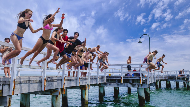 Beachgoers seek a break from hot weather at Port Melbourne.