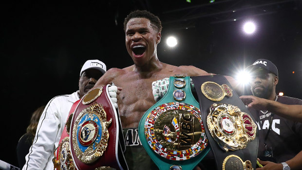 Unbeaten Devin Haney with the spoils of victory.