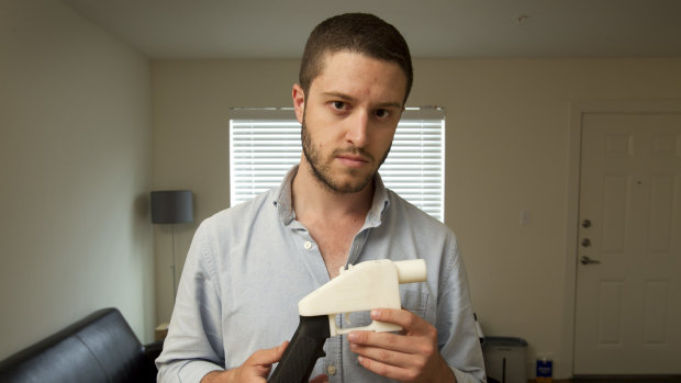Cody Wilson, the founder of Defense Distributed, shows a plastic handgun made on a 3D-printer at his home in Austin, Texas. 