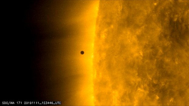 This still image from video issued by NASA's Solar Dynamics Observatory shows Mercury as it passes between Earth and the sun on Monday, November 11.