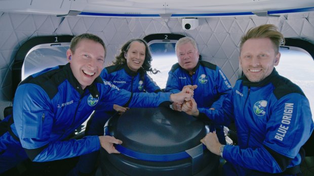 Blue Origin NS-18 crew Glen de Vries, Audrey Powers, William Shatner and Chris Boshuizen inside the capsule.