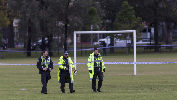 Detectives comb the Princes Park pitch for clues after a woman's body was found.