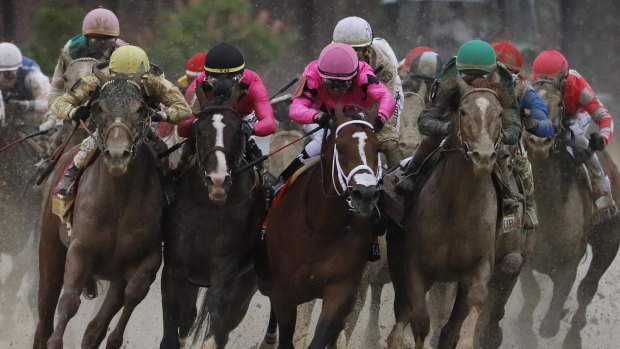 Jockey Luis Saez on Maximum Security (second from right) in the Kentucky Derby. Legal action is being taken over the horse's disqualification.