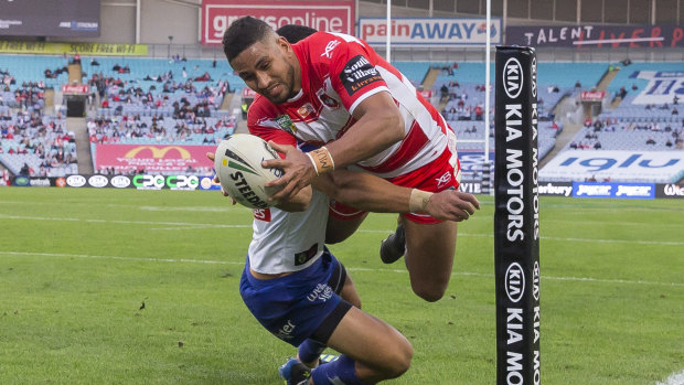 Nene McDonald scores for the Dragons against the Bulldogs at ANZ Stadium on Monday. 21,376 people turned up.