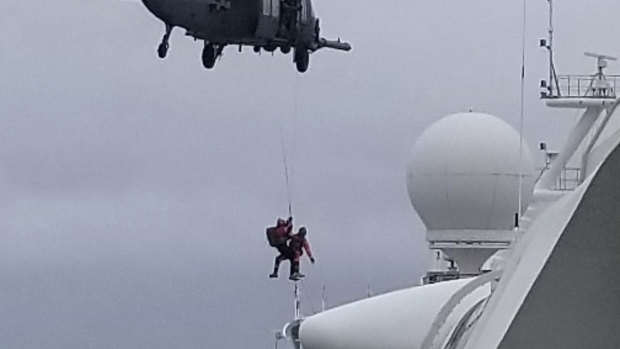 A Coast Guard helicopter delivering virus testing kits to the Grand Princess cruise ship off the California coast. 