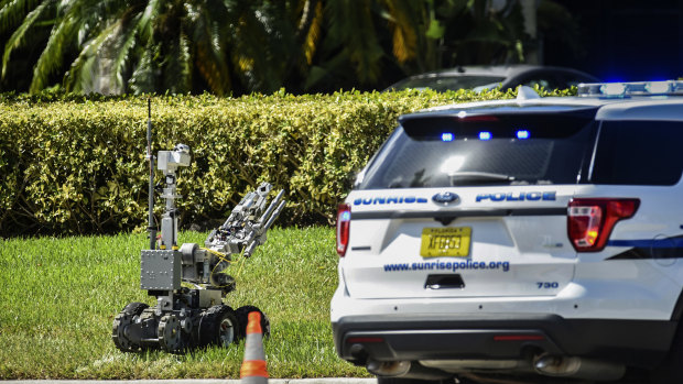 A bomb defusing robot is sent into the Florida building that houses Congresswoman Deborah Wasserman Schultz's office.