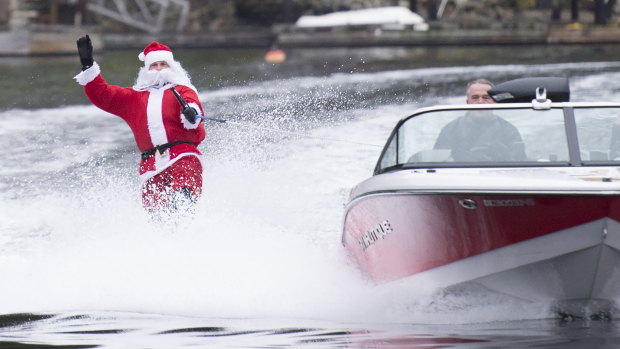 A water skier dressed as Santa Claus skis in Deep Cove, North Vancouver, British Columbia, on Christmas Eve.