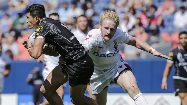 Controversial match: New Zealand's Dallin Watene-Zelezniak tries to evade England's James Graham in Denver.