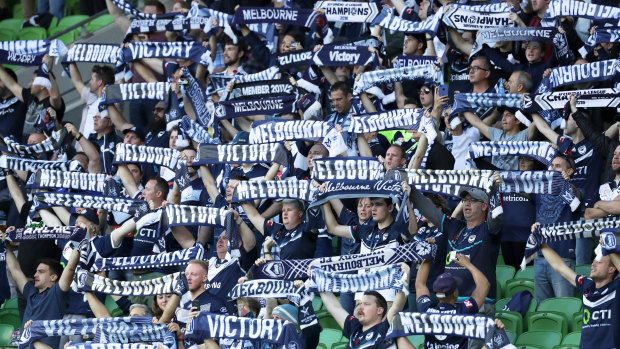 True Blue: Happy Victory fans fly their colours at AAMI Park.