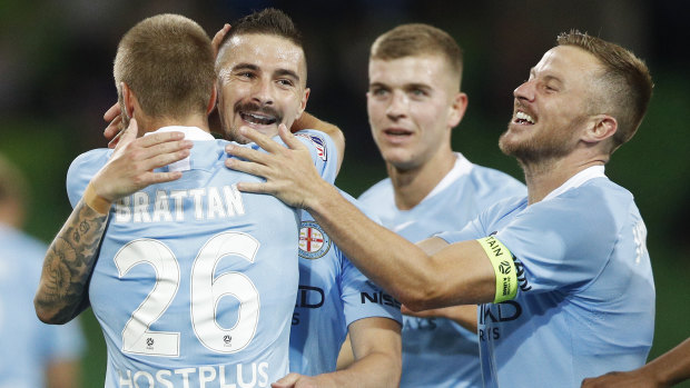 Jamie Maclaren of Melbourne City (second from left) celebrates after scoring a goal.