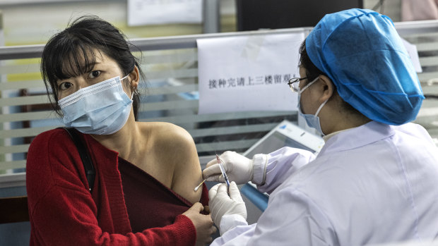 Residents receive the COVID-19 vaccine at a community hospital in Wuhan in April. 