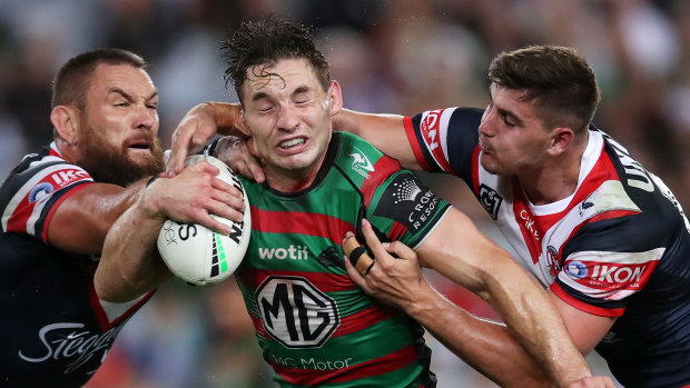 Cameron Murray is tackled by the Roosters defence.