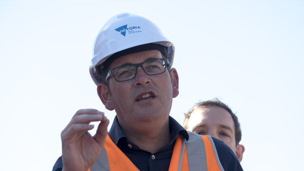 Victorian Premier Daniel Andrews speaks to the media during a visit to a railway level crossing removal site in Murrumbeena, Victoria, in January.