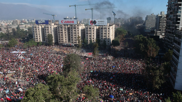 Thousands of demonstrators march during a national strike in Santiago, Chile, on Tuesday.