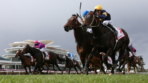 Brutal (right) fights back to win at Flemington.