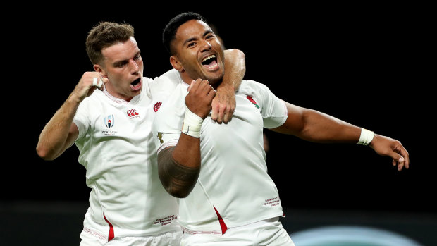 Manu Tuilagi, right, celebrates with teammate George Ford after scoring his second try for England.