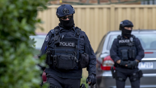 Federal Police guard the house in Dallas where a terror raid was carried out.