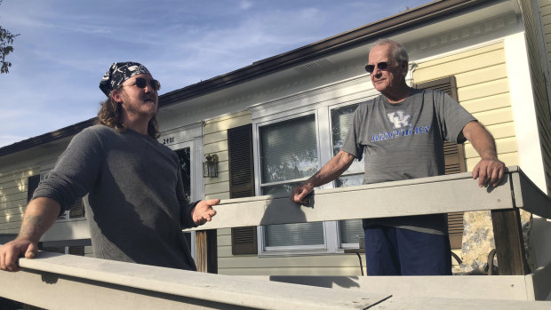 Don Albrecht, right, discusses the upcoming midterm election with his friend and handyman Joseph Robertson in Louisville, Ky. Albrecht voted for Trump in 2016 but has become frustrated with Trump’s bombastic and divisive rhetoric.