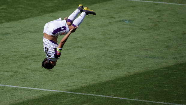 Sam Kerr celebrates her hat-trick with a backflip.