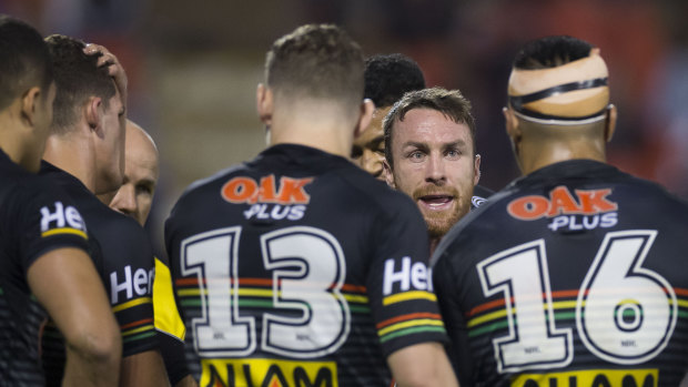 Sticking solid: James Maloney tries to rally the Panthers against the Warriors.