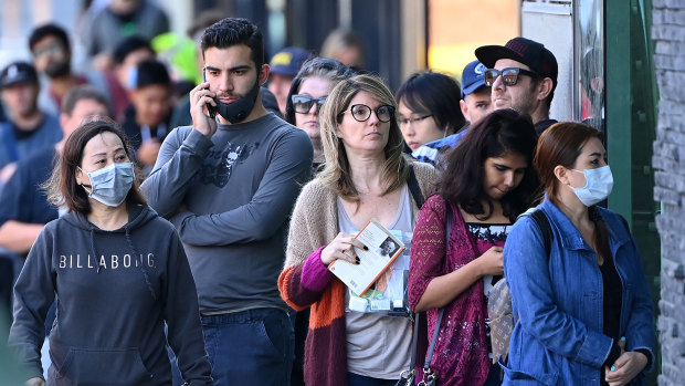 Applicants line up at Centrelink amid the COVID-19 joblessness shock.