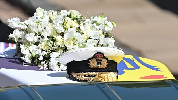 Prince Philip’s Royal Navy cap rests on his coffin. 