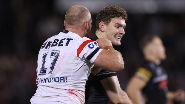 Panthers back-rower Liam Martin and the Roosters’ Matt Lodge square off on Friday night.