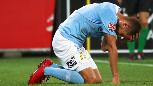 City's Dario Vidosic holds his head during the loss to Sydney FC.