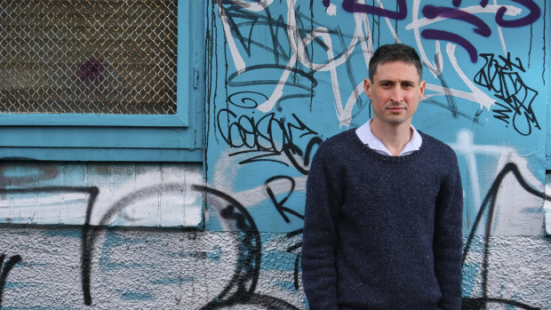 RMIT PhD researcher Liam Davies, outside a site in Clifton Hill being prepared for sale by the state government despite being identified by academics as one of the top five state sites for social housing.   