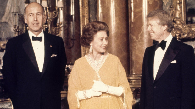 Valery Giscard d'Estaing, left, with Queen Elizabeth II and then US president Jimmy Carter at Buckingham Palace in 1977.
