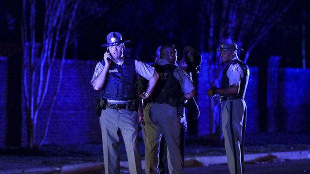 South Carolina state troopers gather near the scene of the incident.