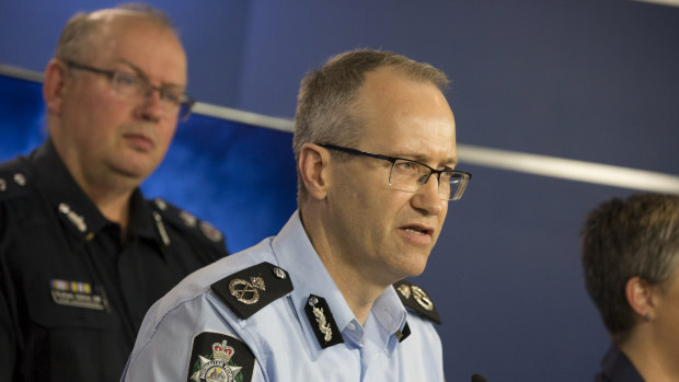 AFP Assistant Commissioner of Ian McCartney (centre) at a press conference on Saturday morning with Victoria Police chief commissioner Graeme Ashton.