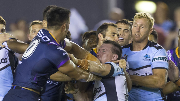 Nelson Asofa-Solomona of the Storm and Paul Gallen of the Sharks come to grips as frustrations boil over.