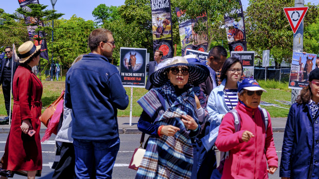 Racegoers cross paths with anti-racing protesters.