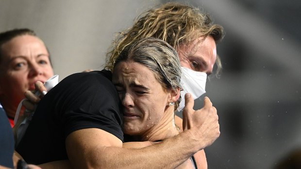 Shayna Jack hugs her coach Dean Boxall after finishing second in the women’s 100m freestyle event at the Australian Swimming Championships.