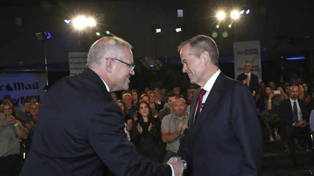 Prime Minister Scott Morrison and Opposition Leader Bill Shorten shake hands before the Brisbane debate.