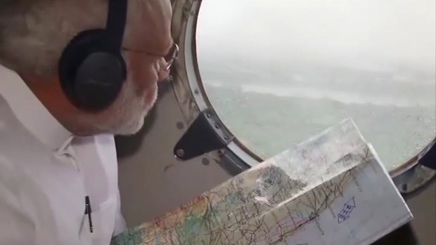 Indian Prime Minister Narendra Modi surveys the flood affected areas in Kerala by plane last weekend.