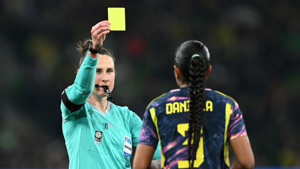 Daniela Arias is shown a yellow card.