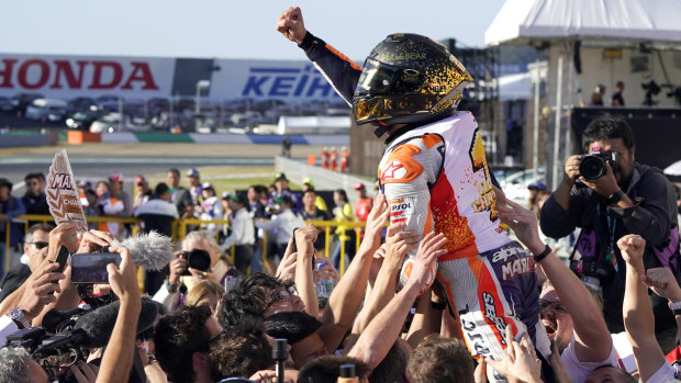 Marc Marquez celebrates with his team after victory in Japan.