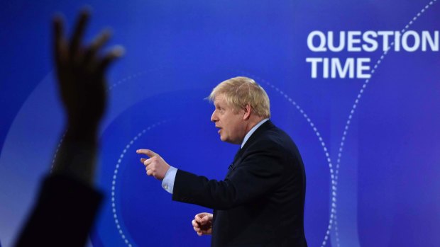 British Prime Minister Boris Johnson talks onstage during the BBC Question Time Leaders' Special on Friday.