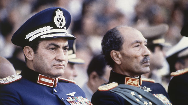 This 1981 photo was taken moments before then Egyptian president Anwar Sadat, right, and vice-president Hosni Mubarak were shot by soldiers who opened fire from a truck during a parade at review, killing Sadat and injuring Mubarak. 
