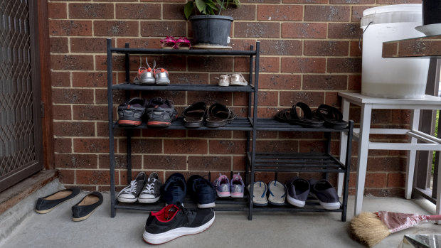 Shoes rest at the house in Dallas where a suspect was arrested.