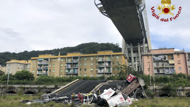 Firefighters work to find survivors among the rubble.