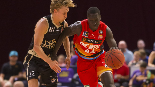 On the pace: Sunday Dech of the Wildcats heads downcourt against the Kings at Qudos Bank Arena.